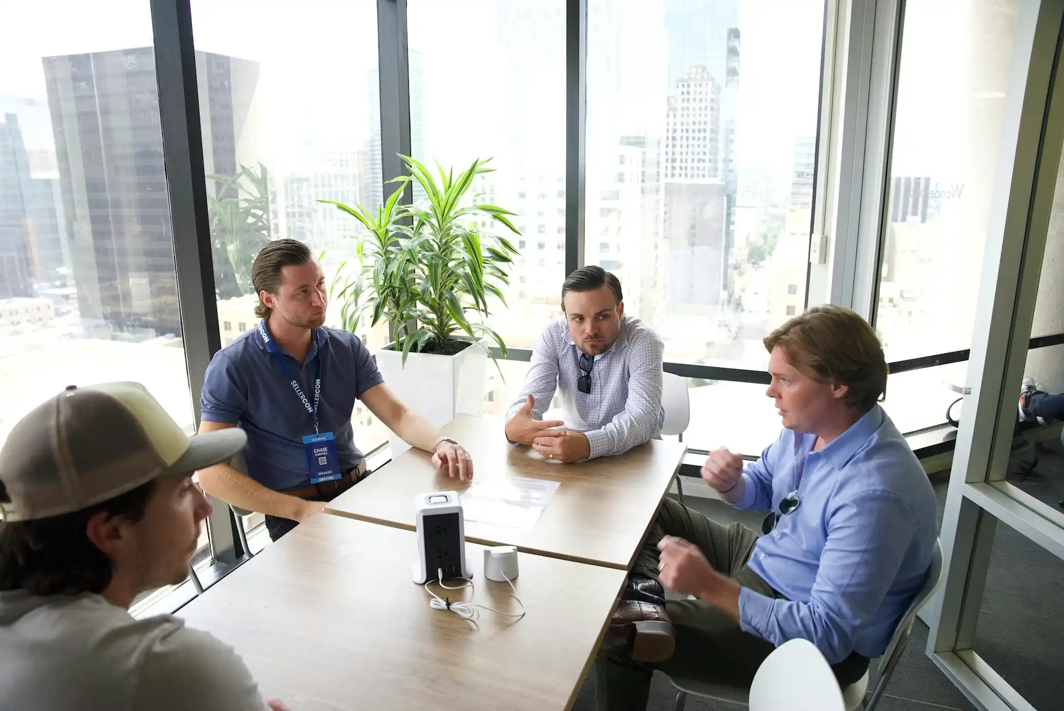 Founders and investors discussing strategy in a modern office.